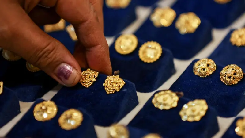 Gold DIPS AS A stronger dollar weighs on pricing amid renewed U.S.-Iran tensions